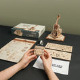 Load image into Gallery viewer, Wooden Puzzle Magic Cello Mechanical Music Box
